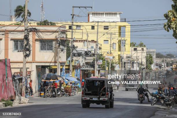 Police patrol the streets the day after the assassination of President Jovenel Moïse near the National Palace in Port au Prince on July 8, 2021. -...
