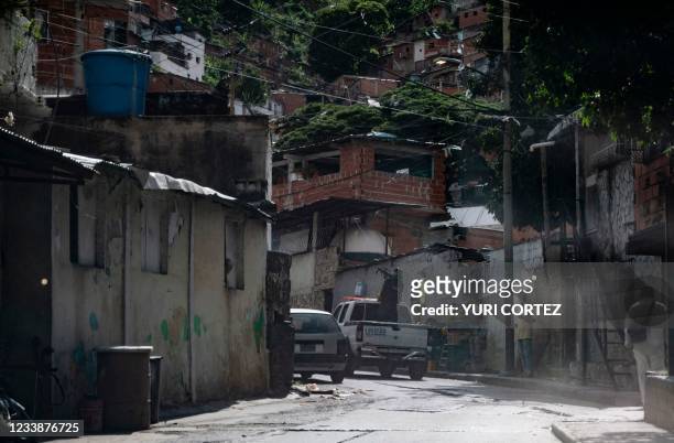 Member of the Scientific, Criminal and Forensic Investigations Corps aims his sub-machine gun while entering the neighborhood of El Valle in the...