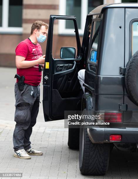 July 2021, Lower Saxony, Hanover: Hendrik Vorreiter of the Hanover police carries out a vehicle check in the city centre. Police officers in Hanover...
