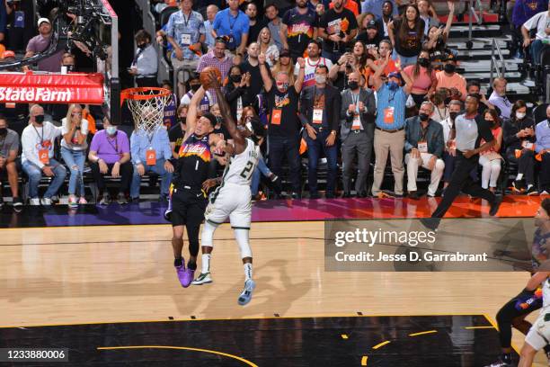 Jrue Holiday of the Milwaukee Bucks blocks the shot of Devin Booker of the Phoenix Suns during Game Two of the 2021 NBA Finals on July 8, 2021 at...