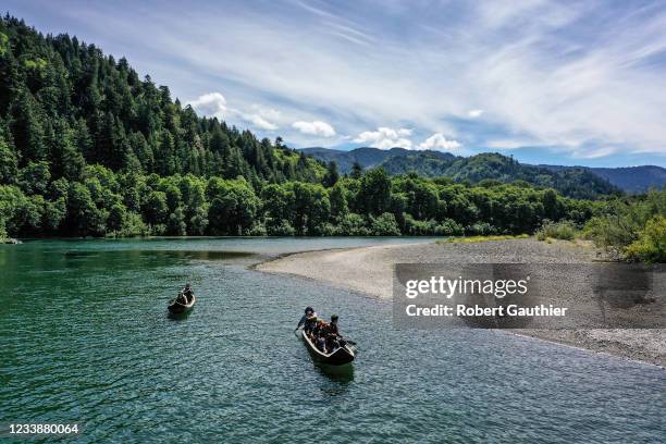 Klamath, CA, Thursday, June 10, 2021 - Yurok guides paddle tourists along the Klamath River in traditional canoes hand crafted from Redwood trees.