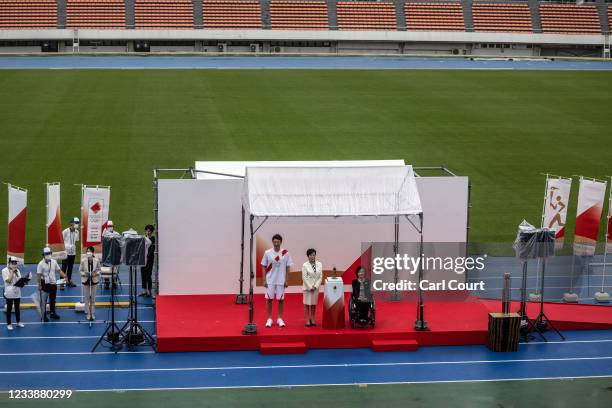 Tokyo Governor Yuriko Koike attends an unveiling ceremony for the Tokyo leg of Olympic torch relay with Aki Taguchi, official ambassador of the Tokyo...
