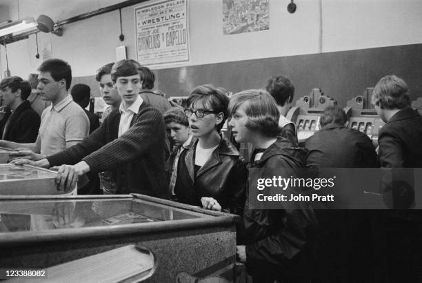 Young Mods in an amusement arcade in London, 1964.