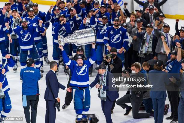 Steven Stamkos of the Tampa Bay Lightning hoists the Stanley Cup overhead after the Tampa Bay Lightning defeated the Montreal Canadiens in Game Five...