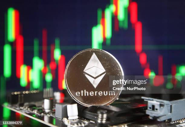 Ethereum cryptocurrency coin and a graph are pictured in Kyiv on 08 July, 2021.