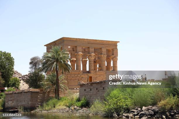 July 8, 2021 Xinhua -- Photo taken on June 26, 2021 shows a view of the Philae temples on Agilkia Island in Aswan, Egypt. On a brief boat voyage in...
