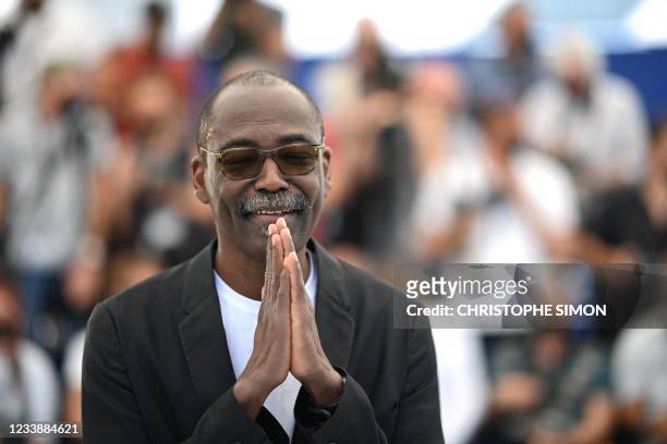 Chadian director Mahamat-Saleh Haroun poses during a photocall for the film "Lingui" at the 74th edition of the Cannes Film Festival in Cannes,...