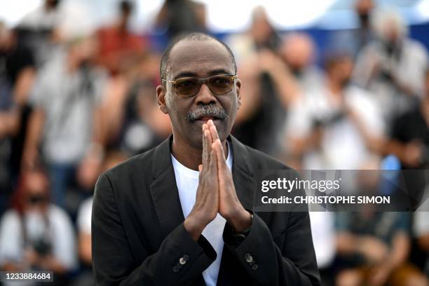 Chadian director Mahamat-Saleh Haroun poses during a photocall for the film "Lingui" at the 74th edition of the Cannes Film Festival in Cannes,...