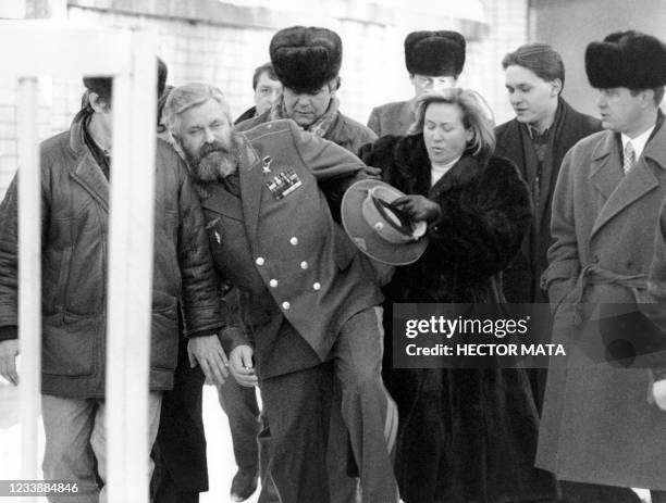 Leader of the ultra-nationalist Liberal Democratic Party of Russia Vladimir Zhirinovsky and his wife Galina listen a retired officer playing an...