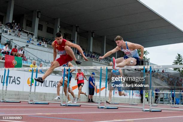 Asier Martinez of Spain and Joshua Zeller of Great Britain compete during Men's 110m Hurdles Round 1 during 2021 European Athletics U23 Championships...