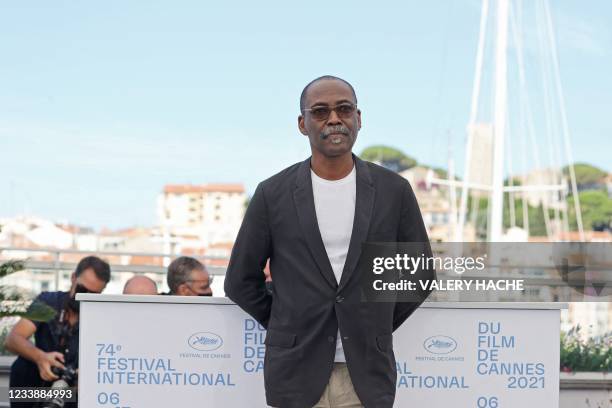 Chadian director Mahamat-Saleh Haroun poses during a photocall for the film "Lingui" at the 74th edition of the Cannes Film Festival in Cannes,...