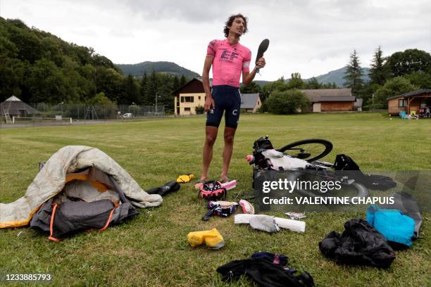 Australian cyclist Lachlan Morton sets up his bivouac at the end of the 13th day of his solo alternative Tour de France cycling race at the Les...