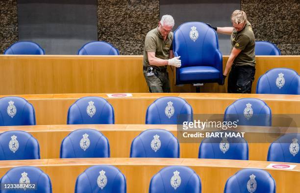 The seats of the MPs are disassembled in the plenary hall of the Dutch House of Representatives in The Hague on Friday July 9. - During the summer...