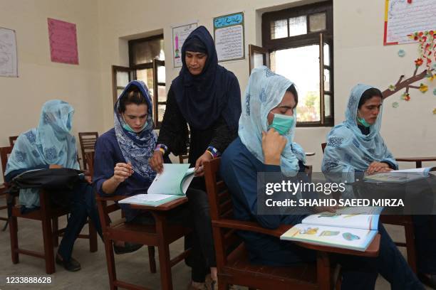 In this picture taken on July 8 transgender students attend their class at the first government-funded school for transgender women, in Multan.