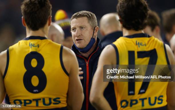 Scott Burns, Senior Assistant Coach of the Crows addresses his players during the 2021 AFL Round 17 match between the Essendon Bombers and the...