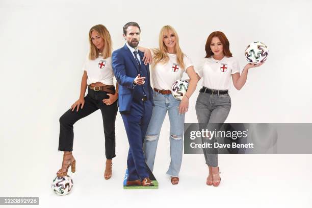 Jenny Frost, Liz McClarnon and Natasha Hamilton of Atomic Kitten pose with a cardboard cutout of England manager Gareth Southgate to celebrate...