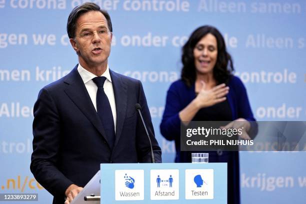 Outgoing Netherlands' Prime Minister Mark Rutte gives a press conference with outgoing Netherlands' Health Minister in the Hague on July 9, 2021. -...