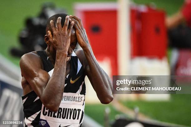 First-placed Kenya's Timothy Cheruiyot celebrates as he crosses the finish line in the Men's 1500m during the IAAF Diamond League competition on July...