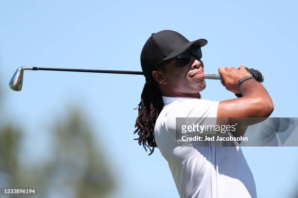 Athlete Larry Fitzgerald tees off on the first hole during round one of the American Century Championship at Edgewood Tahoe South golf course on July...