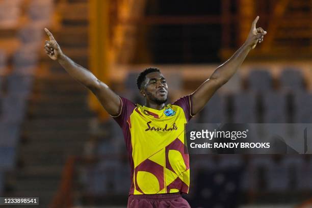 Obed McCoy of West Indies celebrates the dismissal of Mitchell Starc of Australia during the 1st T20I between Australia and West Indies at Darren...