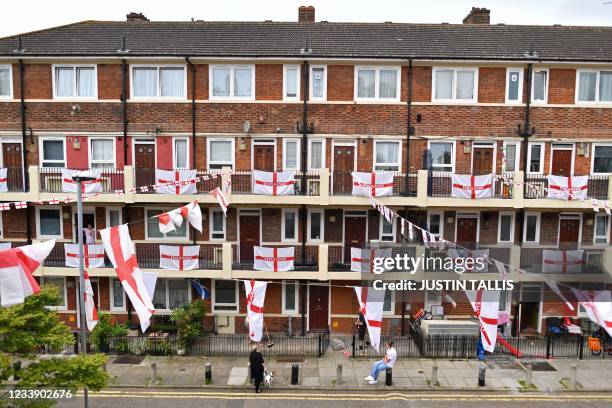 St George's flags, the national flag of England, fly from residents' homes at the Kirby Estate in Bermondsey, south London on July 10 on the eve of...