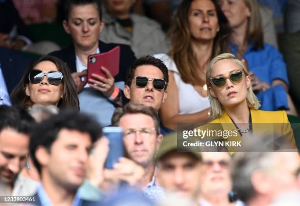 Actor Tom Cruise and English actor Hayley Atwell sit in the Royal box to watch the women's singles final on the twelfth day of the 2021 Wimbledon...