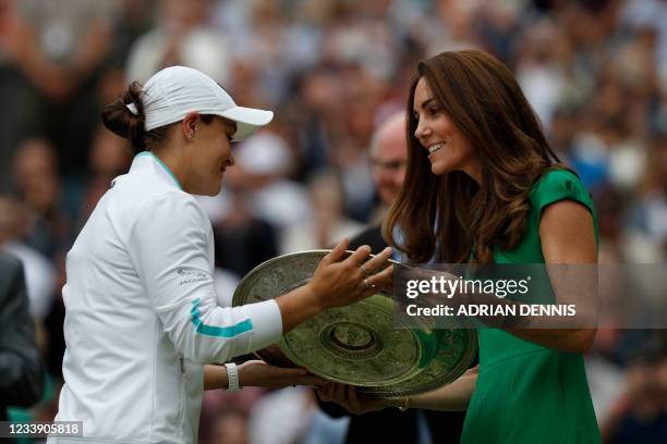 Australia's Ashleigh Barty receives the trophy from Britain's Catherine, Duchess of Cambridge, after defeating Czech Republic's Karolina Pliskova...