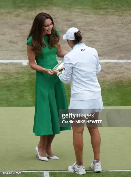 Australia's Ashleigh Barty receives the trophy from Britain's Catherine, Duchess of Cambridge, after defeating Czech Republic's Karolina Pliskova...