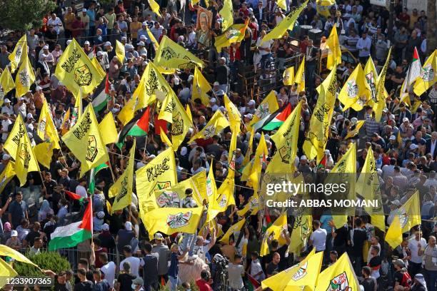 Palestinian supporters of Fatah rally in support of president Mahmud Abbas in the occupied West Bank city of Ramallah, on July 10, 2021.