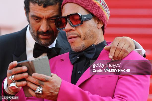 French actor Ramzy Bedia and French rapper and actor JoeyStarr arrive for the screening of the film "De Son Vivant" at the 74th edition of the Cannes...