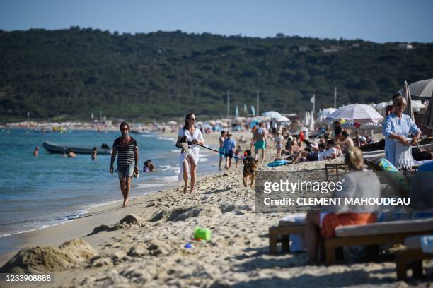 People enjoy 'Pampelonne' beach after France recently eased measures against the spread of the coronavirus Covid-19, in Ramatuelle, close to...