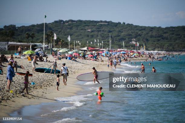 People enjoy 'Pampelonne' beach after France recently eased measures against the spread of the coronavirus Covid-19, in Ramatuelle, close to...