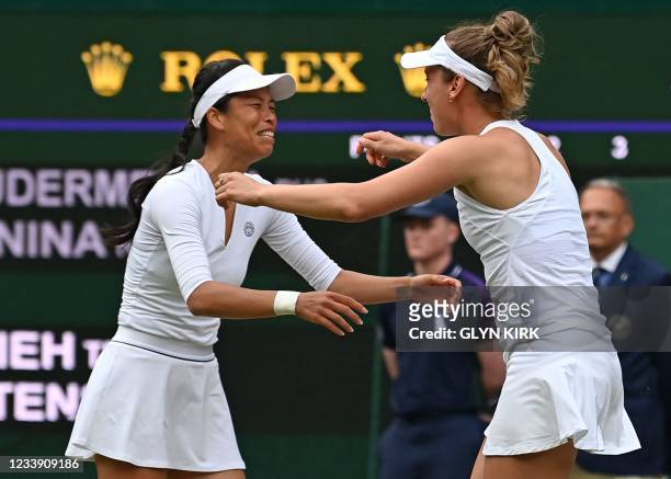Taiwan's Su-Wei Hsieh and Belgium's Elise Mertens celebrate their win against Russia's Veronika Kudermetova and Elena Vesnina return during their...