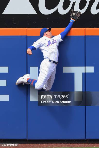 Centerfielder Brandon Nimmo of the New York Mets makes a catch to rob Bryan Reynolds of the Pittsburgh Pirates of a home run in the first inning...