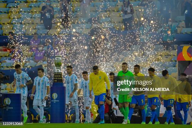Players of Argentina and Brazil step onto the pitch before their Conmebol 2021 Copa America football tournament final match at Maracana Stadium in...