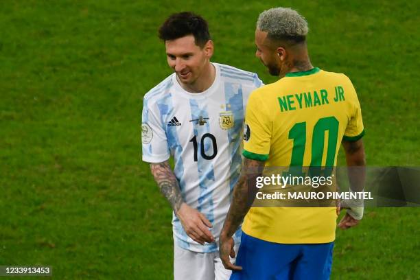 Argentina's Lionel Messi and Brazil's Neymar joke during the Conmebol 2021 Copa America football tournament final match at the Maracana Stadium in...