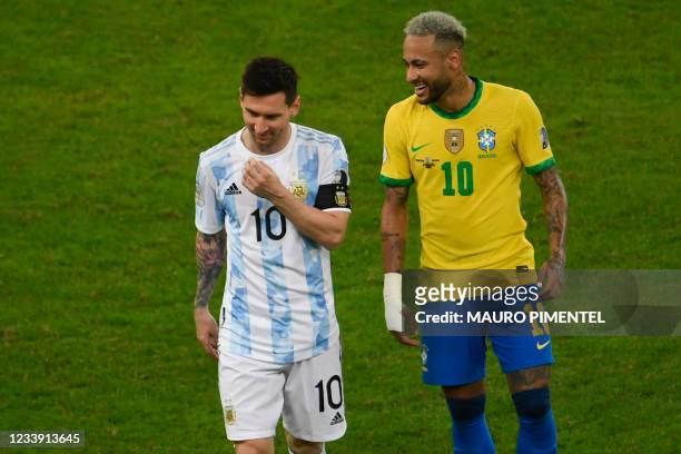 Argentina's Lionel Messi and Brazil's Neymar smile during the Conmebol 2021 Copa America football tournament final match at the Maracana Stadium in...