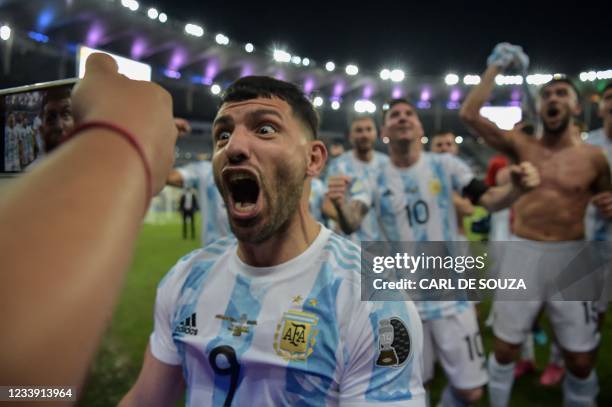 Argentina's Sergio Aguero and teammates celebrate after winning the Conmebol 2021 Copa America football tournament final match against Brazil at...