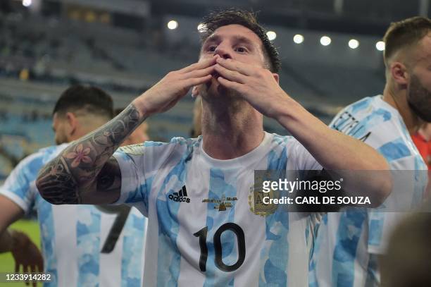 Argentina's Lionel Messi blows a kiss to fans as he celebrates after winning the Conmebol 2021 Copa America football tournament final match against...