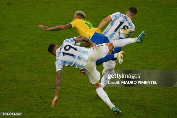 Argentina's Nicolas Otamendi and Argentina's Guido Rodriguez collide with Brazil's Neymar during the Conmebol 2021 Copa America football tournament...