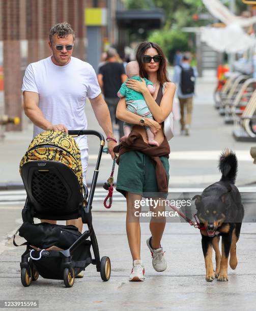 Emily Ratajkowski is seen out for a walk with her baby and her husband Sebastian Bear-McClard on July 10, 2021 in New York City, New York.