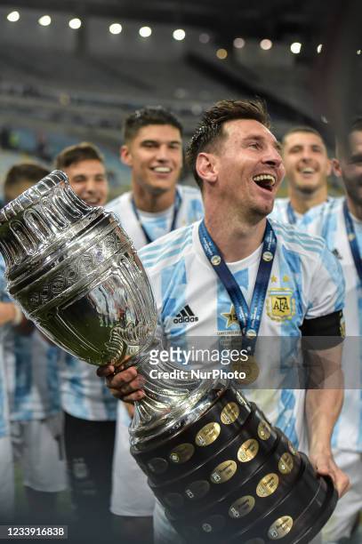 Messi, an Argentine player celebrates the title of champion after the match against Brazil, at the Maracana stadium, for the decision of the Copa...