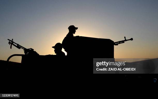 Iraqi forces patrol during military operations in the south and west of the northern Iraqi city of Mosul in search of Islamic State militants, on...