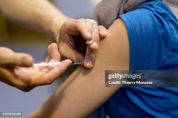 Healthcare worker injects an AstraZeneca vaccine at the 'Vacc Schaerbeek' on July 11, 2021 in Brussels, Belgium. The OxfordAstraZeneca COVID-19...