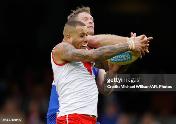 Alex Keath of the Bulldogs and Lance Franklin of the Swans compete for the ball during the 2021 AFL Round 17 match between the Western Bulldogs and...