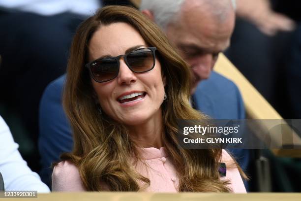 Britain's Catherine, Duchess of Cambridge, sits in the Royal box on the thirteenth day of the 2021 Wimbledon Championships at The All England Tennis...