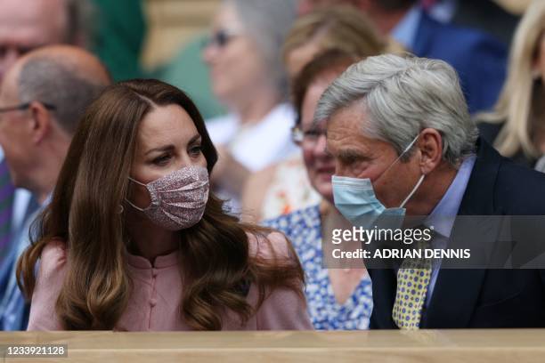 Britain's Catherine, Duchess of Cambridge and her father Michael Middleton, sit in the Royal box on the thirteenth day of the 2021 Wimbledon...
