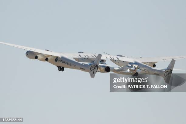 The Virgin Galactic SpaceShipTwo space plane Unity flies at Spaceport America, near Truth and Consequences, New Mexico on July 11, 2021 before travel...