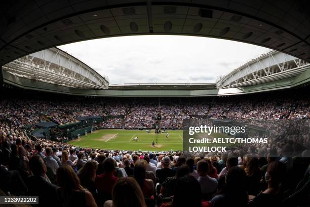 Serbia's Novak Djokovic plays against Italy's Matteo Berrettini during their men's singles final match on Center Court on the thirteenth day of the...