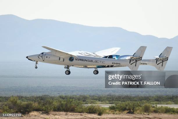 The Virgin Galactic SpaceShipTwo space plane Unity flies at Spaceport America, near Truth and Consequences, New Mexico on July 11, 2021 before travel...